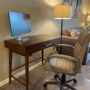 A work from home set up with a desk and desk chair in a furnished apartment in Hilliard Ohio