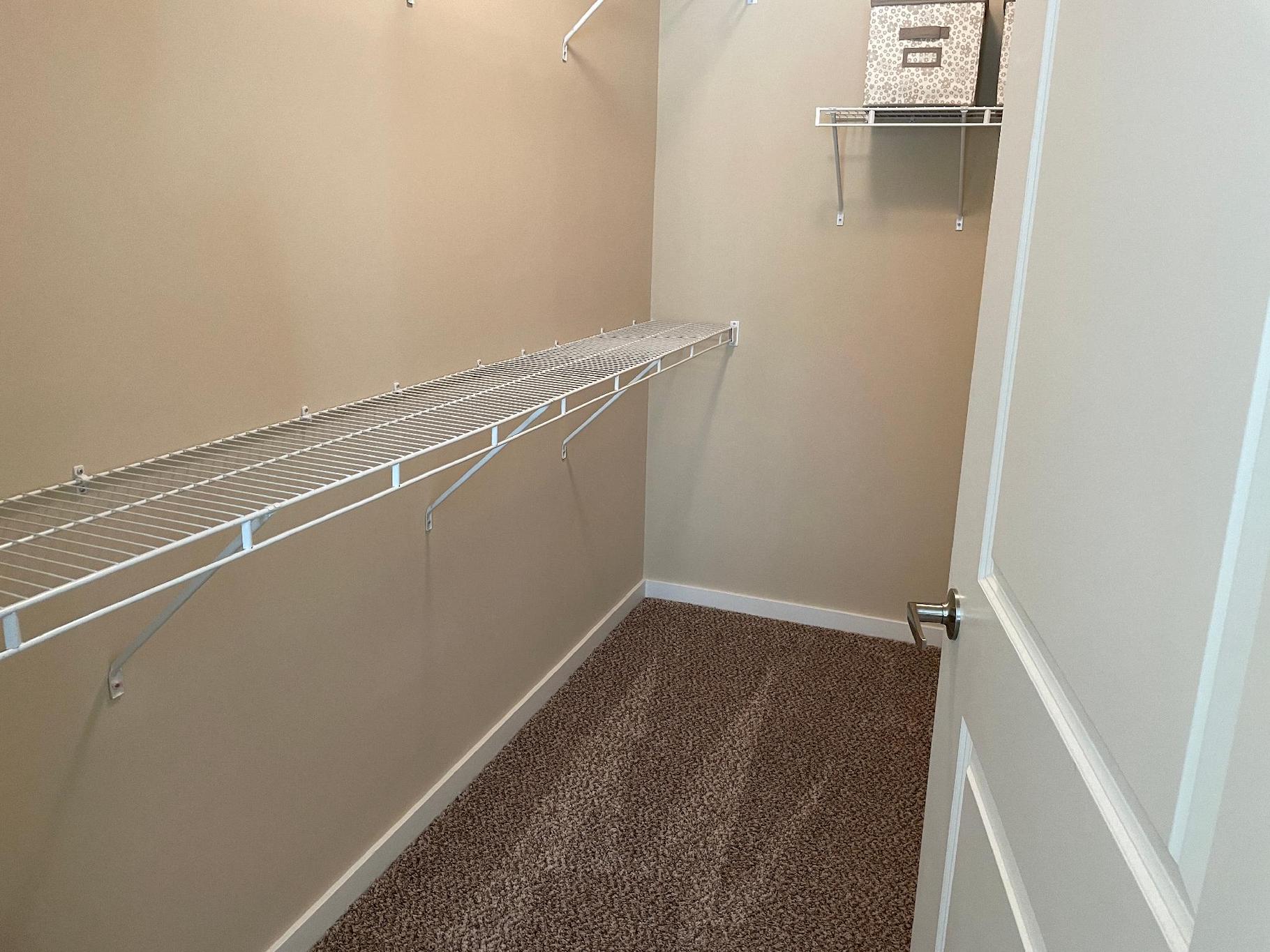 A large walk-in closet in a furnished apartment near New Albany Ohio