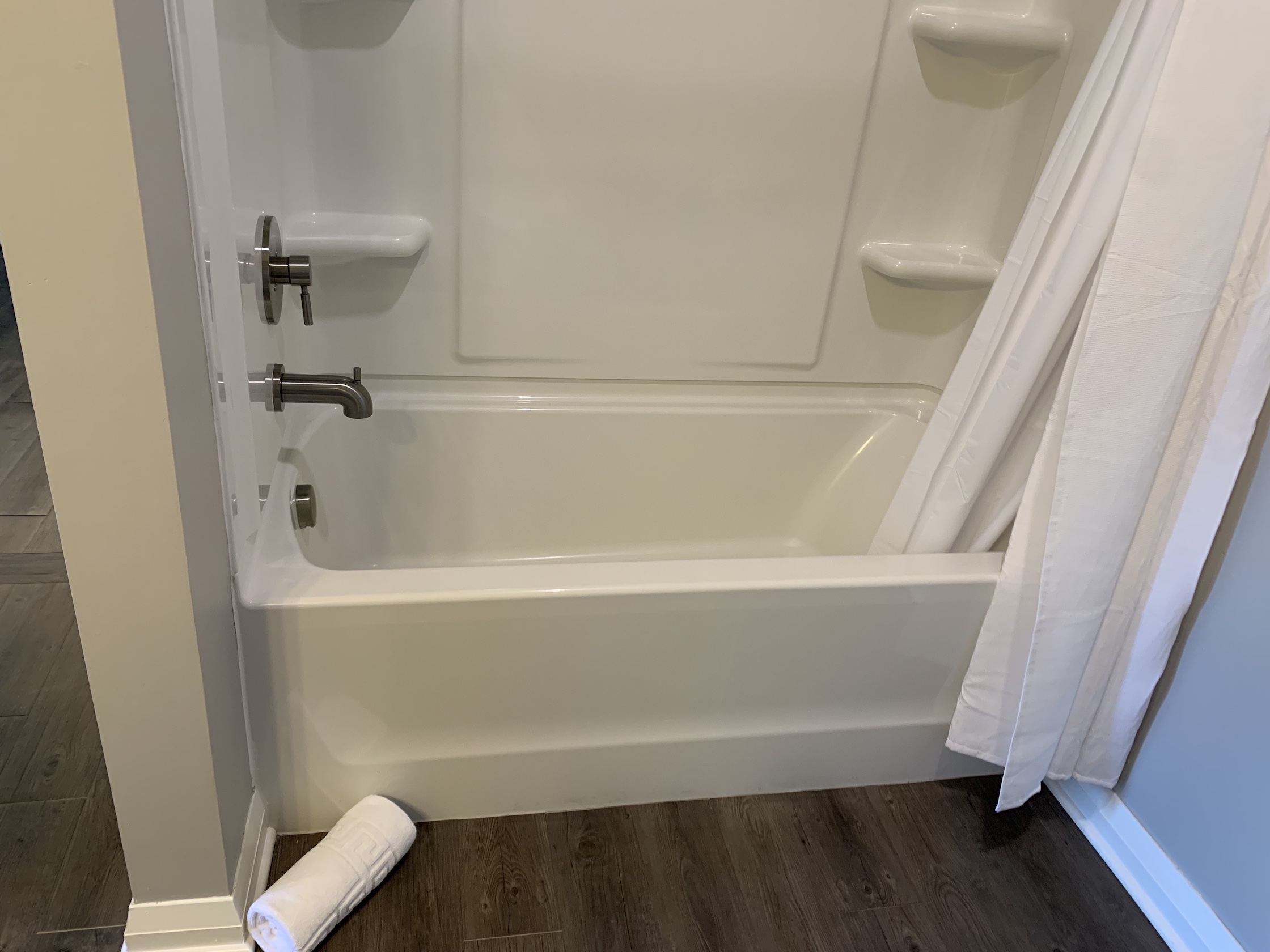 A shower and bath tub in a furnished apartment in Downtown Columbus