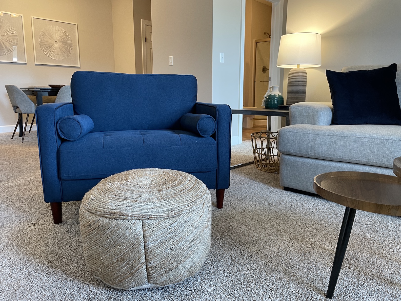 Blue chair with ottoman in a furnished apartment in Westerville Ohio