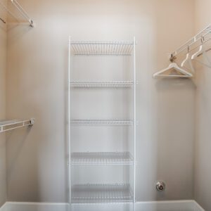 A walk-in closet with hangers in a furnished apartment in Westerville Ohio