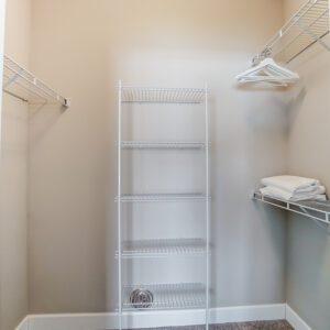 A walk-in closet with hangers in a furnished apartment in Westerville Ohio