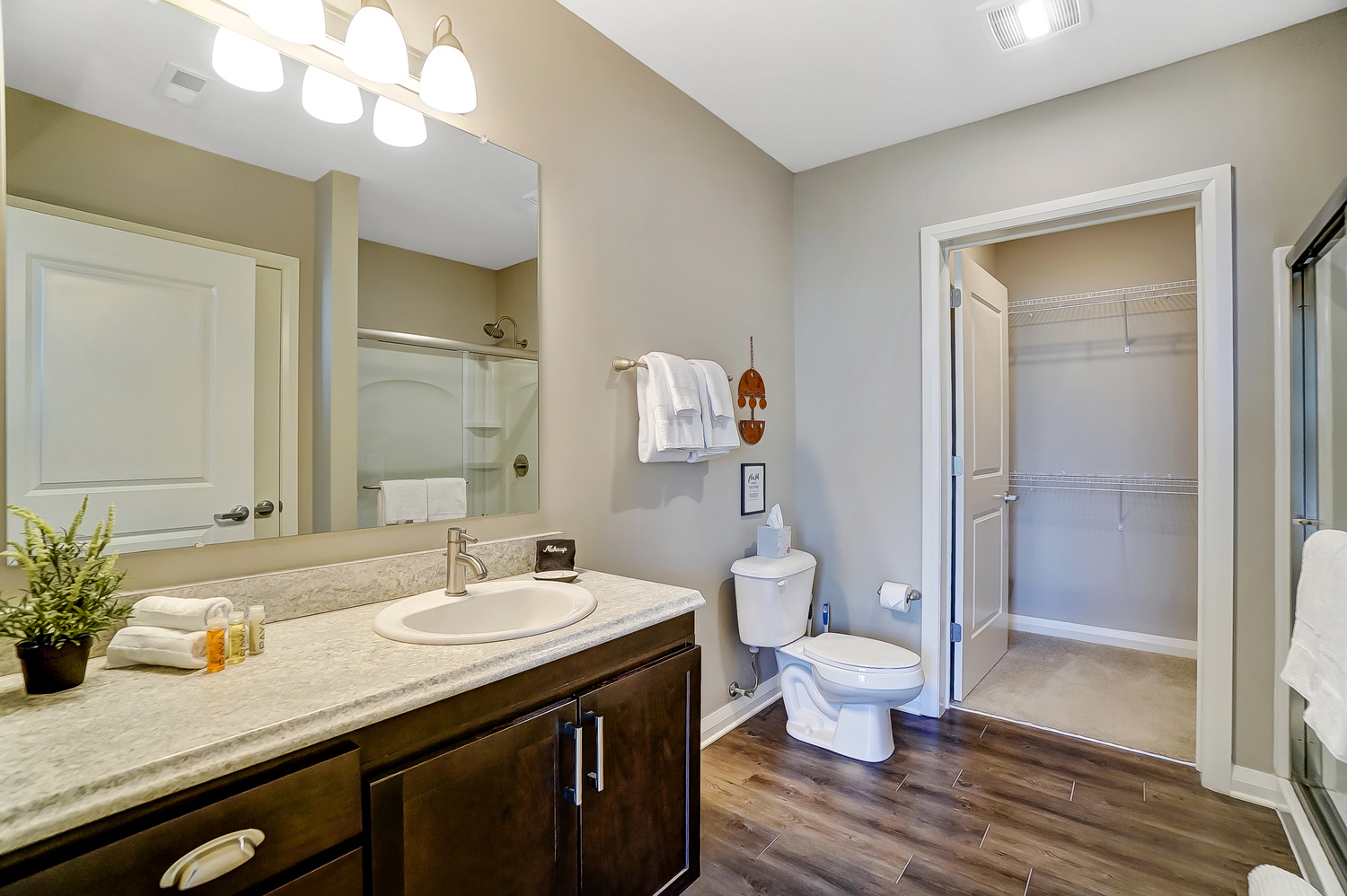 Walk-in shower in the guest bathroom of a furnished apartment in downtown Columbus