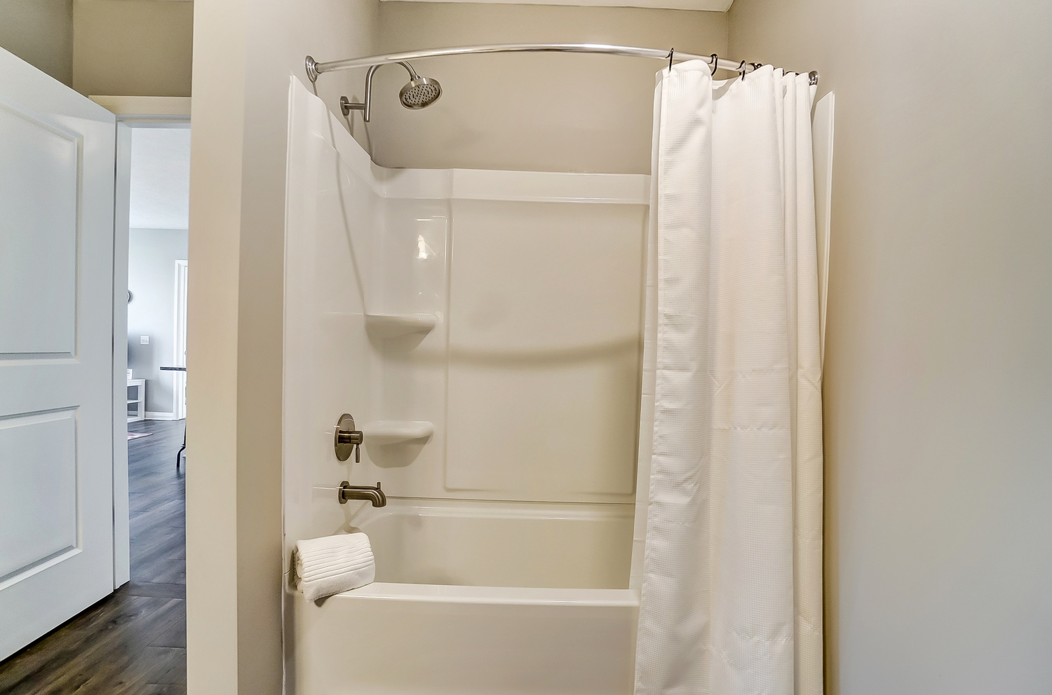 A shower and bath tub in a furnished apartment in Downtown Columbus