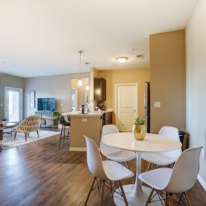 An open concept living space with a living room, dining area, and kitchen in a furnished apartment in Hilliard Ohio