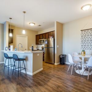 A fully stocked kitchen in a furnished apartment in Hilliard Ohio with counter stools and decor