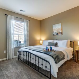 King bed in master bedroom of furnished apartment in Hilliard Ohio