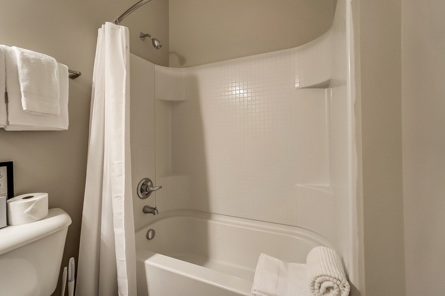 A shower and bath tub in a furnished apartment near New Albany Ohio