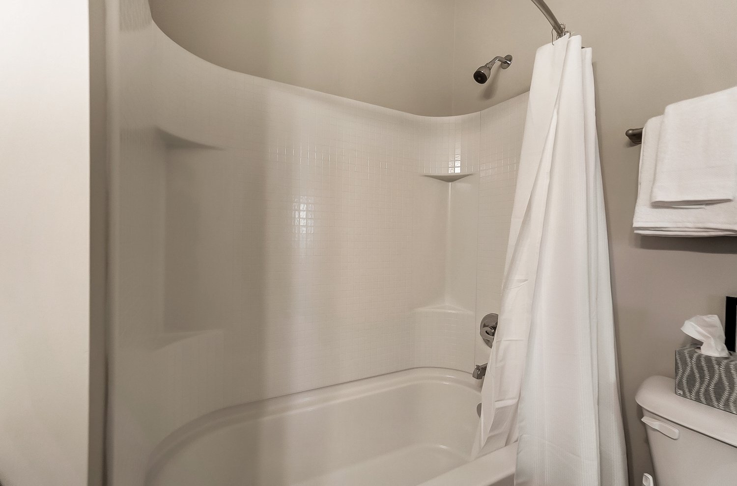 A shower and bath tub in a furnished apartment near New Albany Ohio