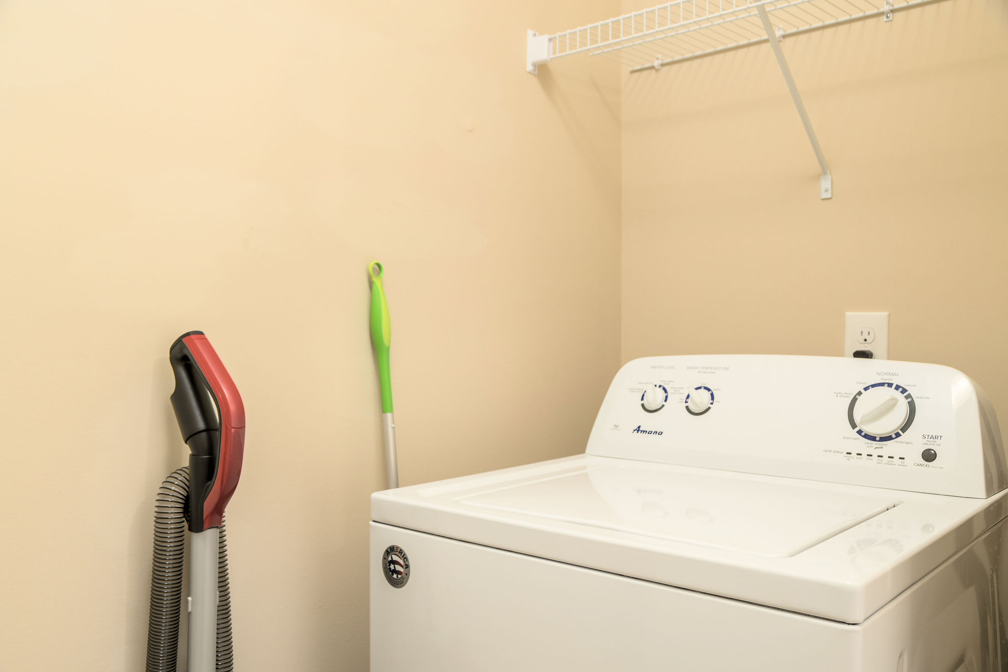 Laundry room in a fully furnished apartment near New Albany Ohio with a washer and dryer