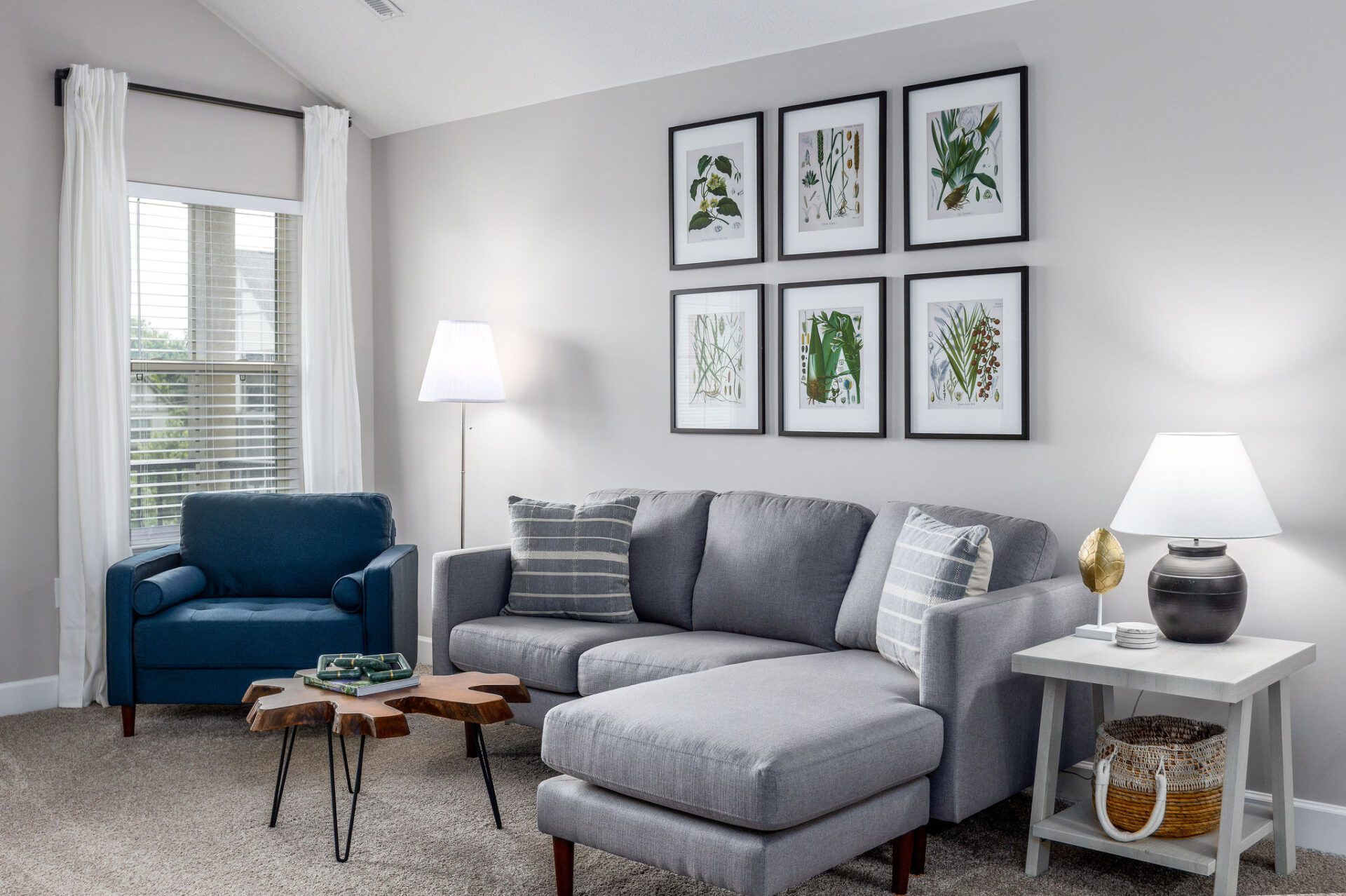 Living room with couch, coffee table and side chair in a furnished apartment near Westerville Ohio