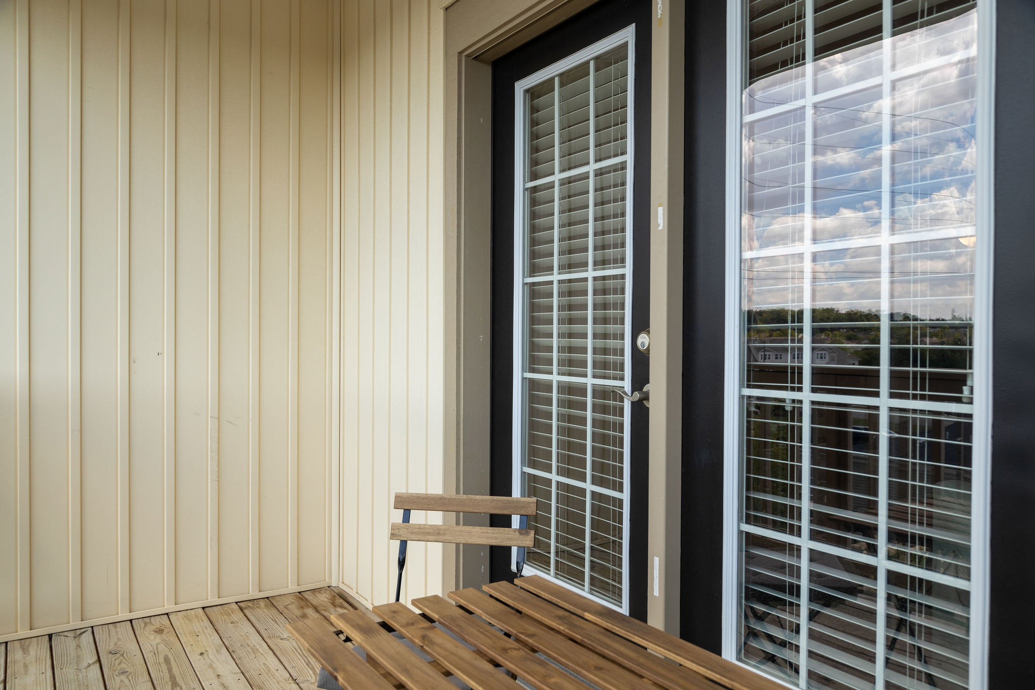 A balcony with outdoor furniture in a furnished apartment near New Albany Ohio