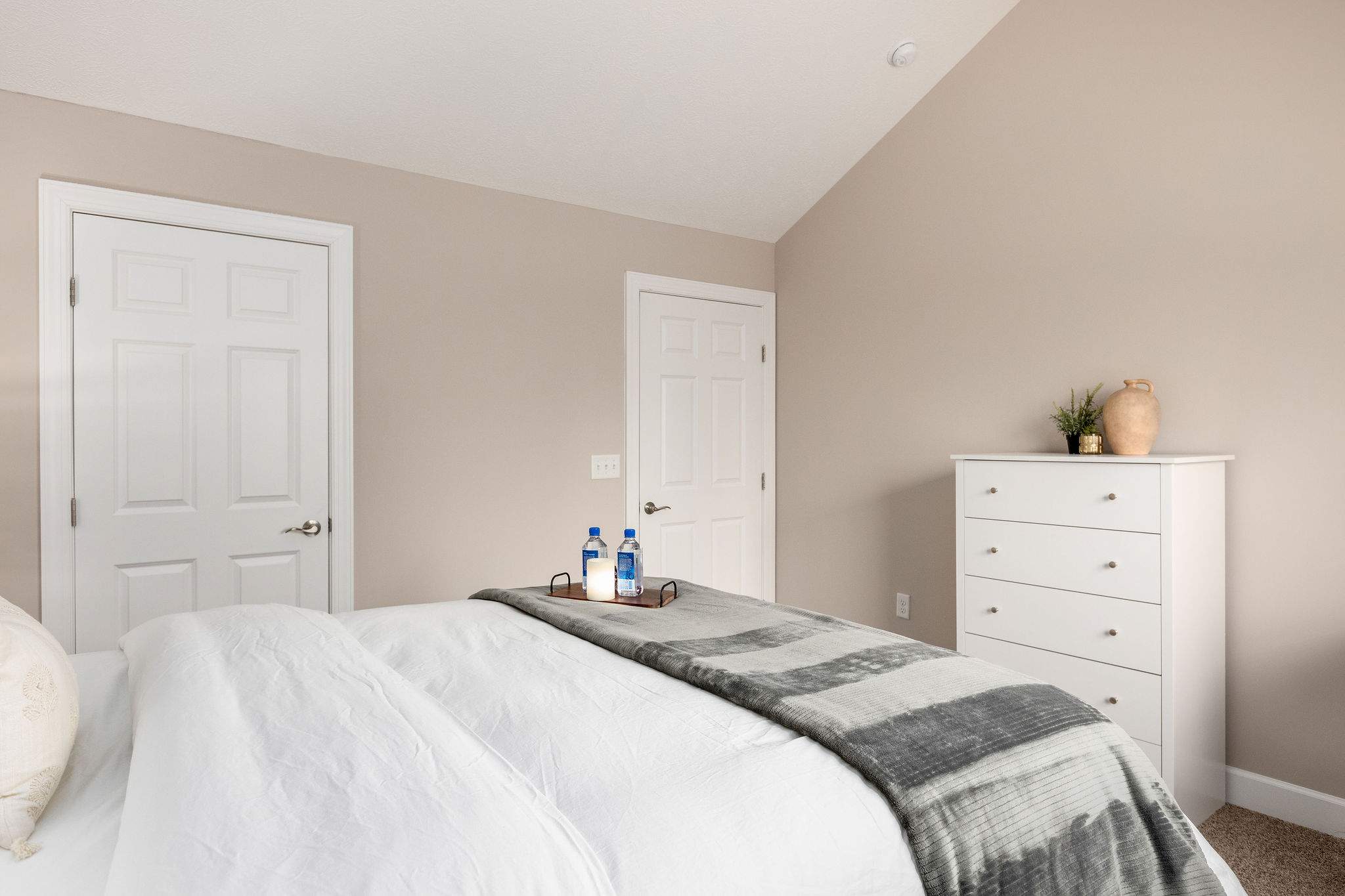 Bedroom with white dresser in a furnished apartment in Weseterville Ohio