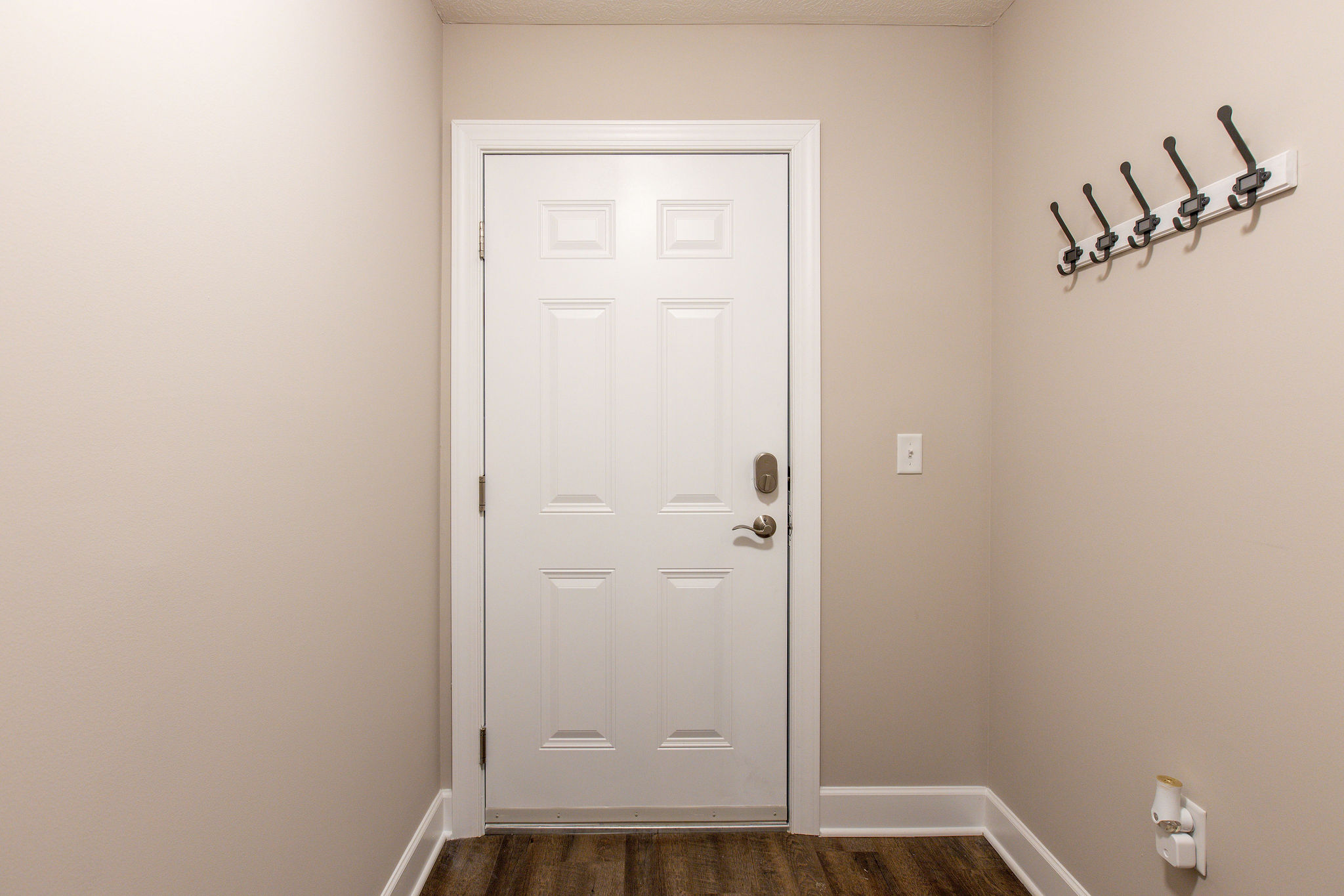 The inside of the front door of a furnished apartment in Westerville Ohio