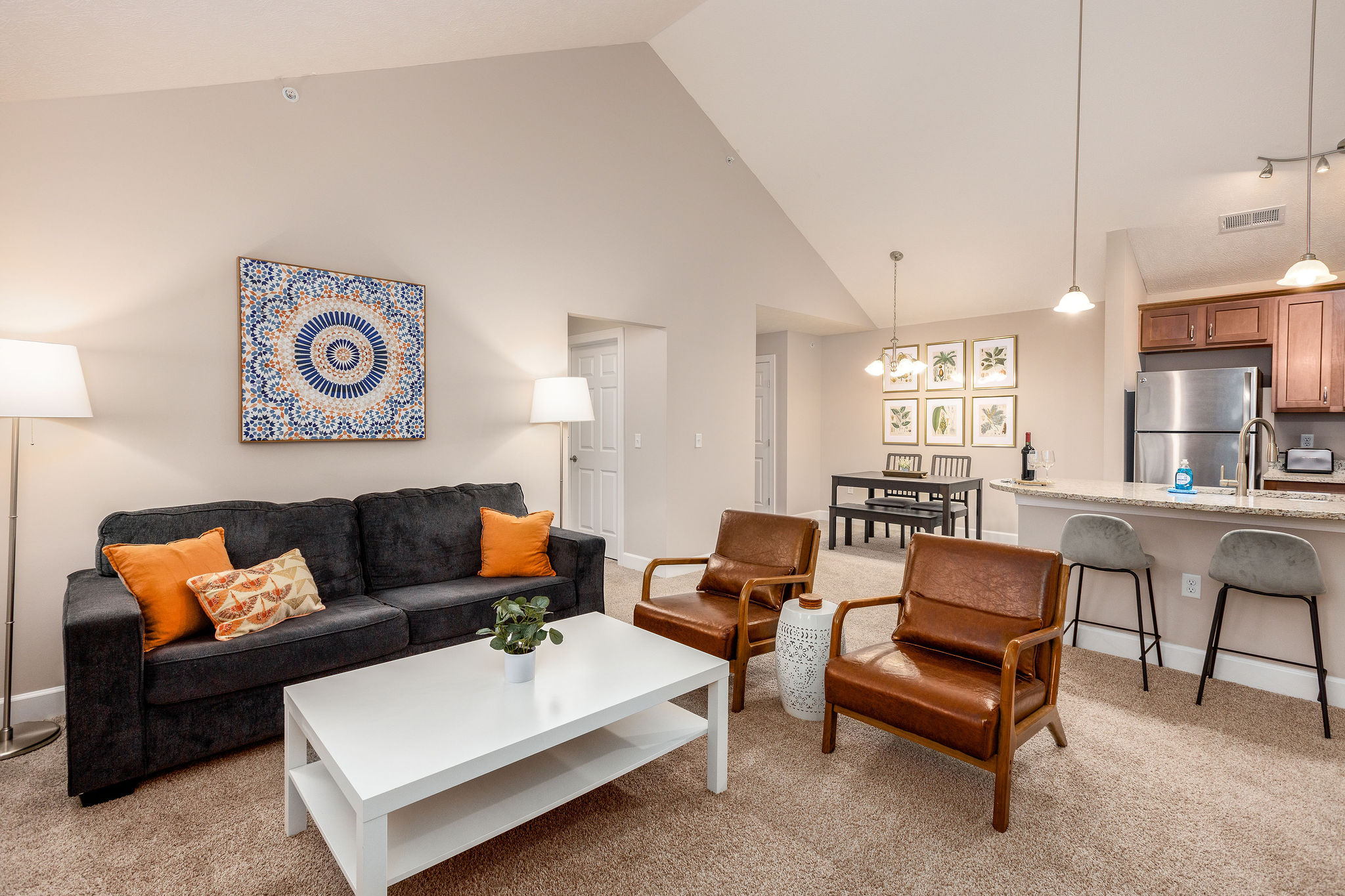 Living room with couch, coffee table and side chair in a furnished apartment in Westerville Ohio