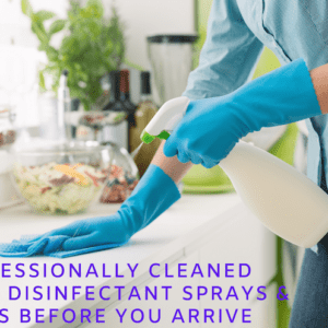 A cleaner with gloves and a spray bottle cleaning a furnished apartment in Dublin Ohio