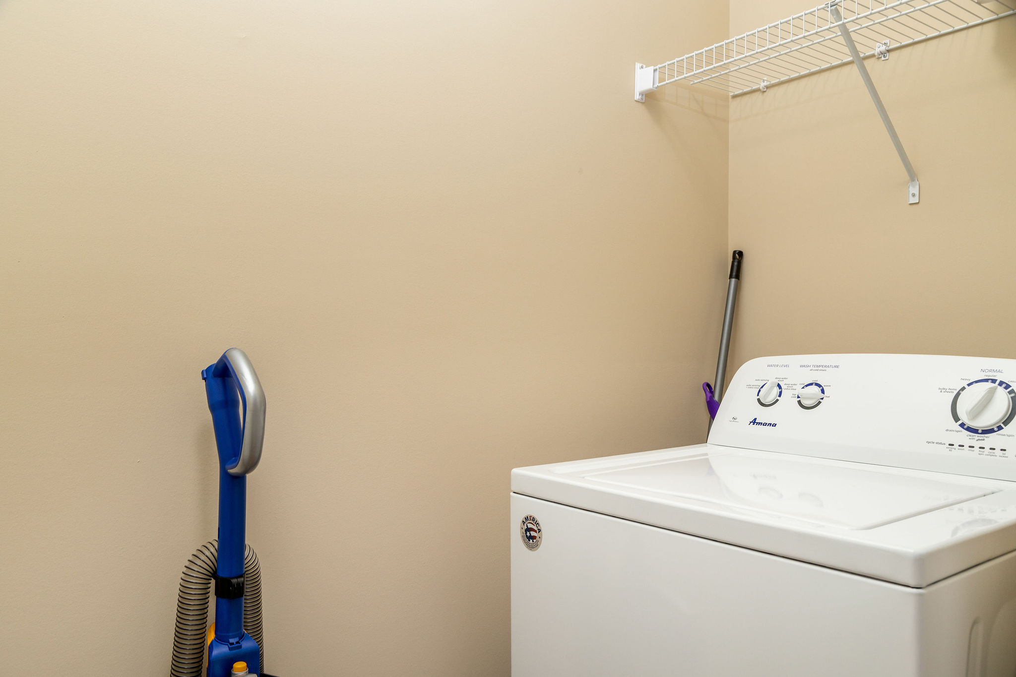 Laundry room in a fully furnished apartment near New Albany Ohio with a washer and dryer