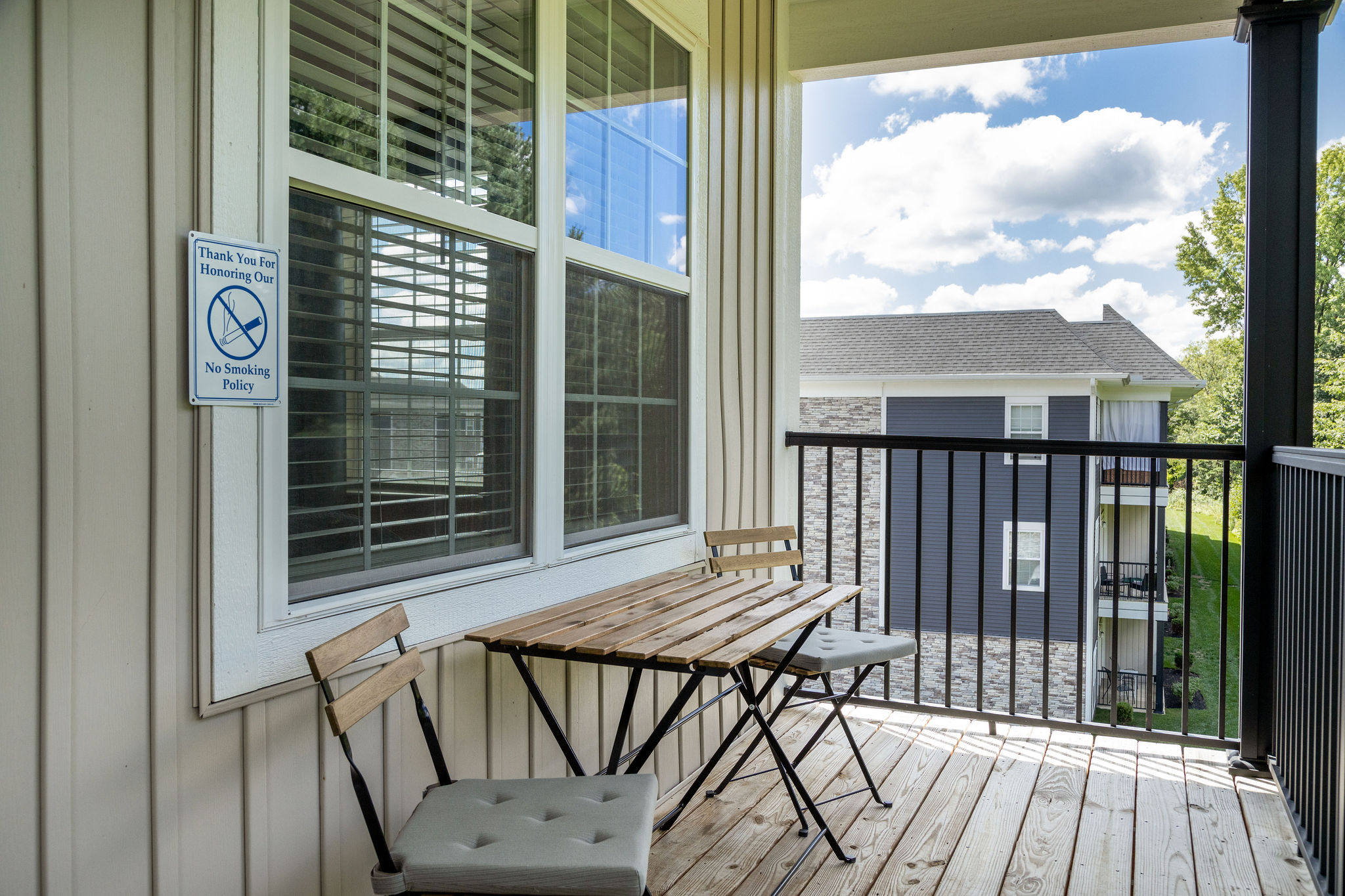 Balcony with chairs and a table in a furnished apartment near New Albany Ohio