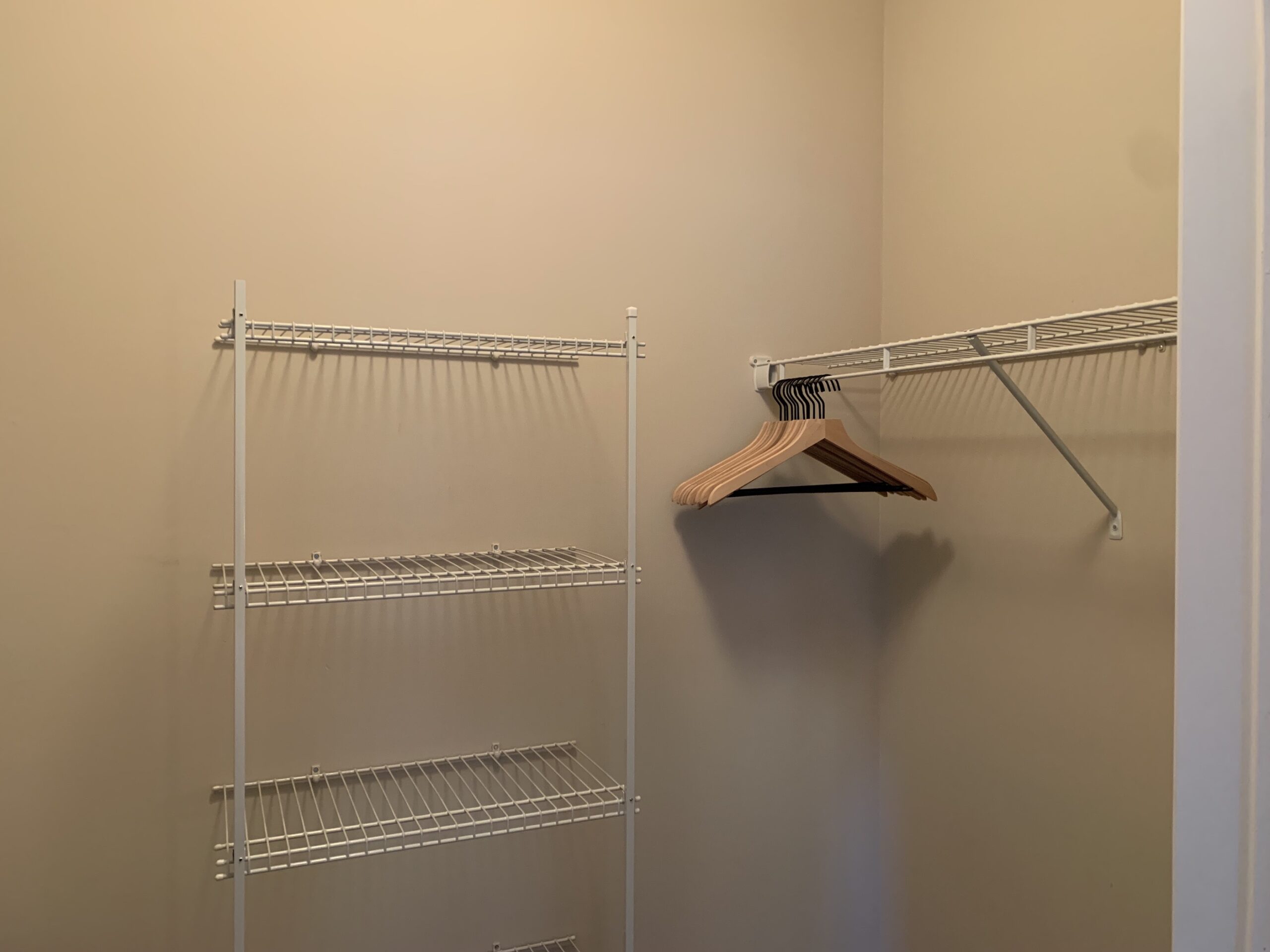 A walk-in closet with hangers in a furnished apartment in Westerville Ohio