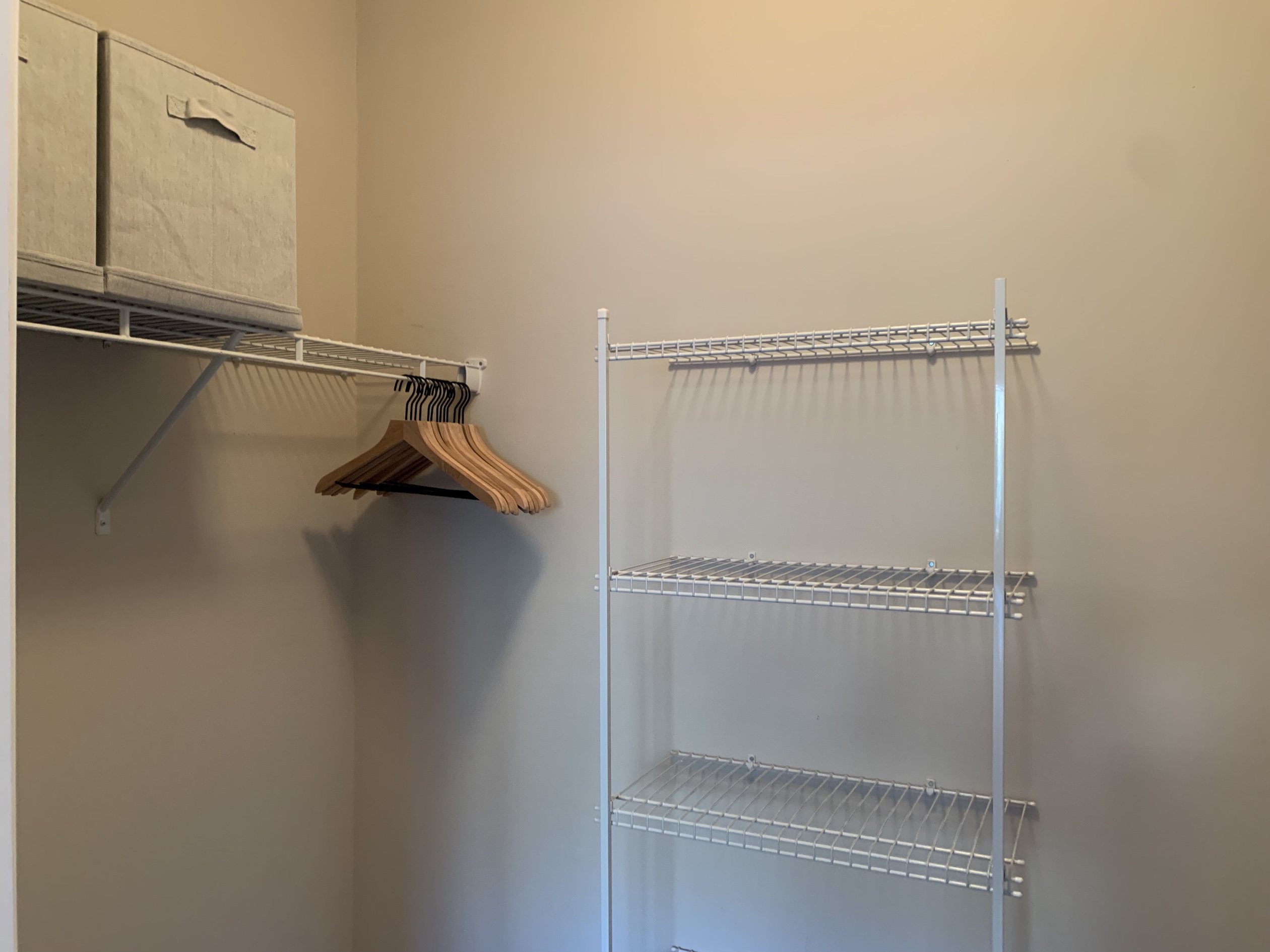 A walk-in closet with hangers in a furnished apartment in Westerville Ohio