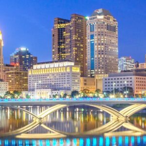 The city of Columbus Ohio at dusk lit up by lights