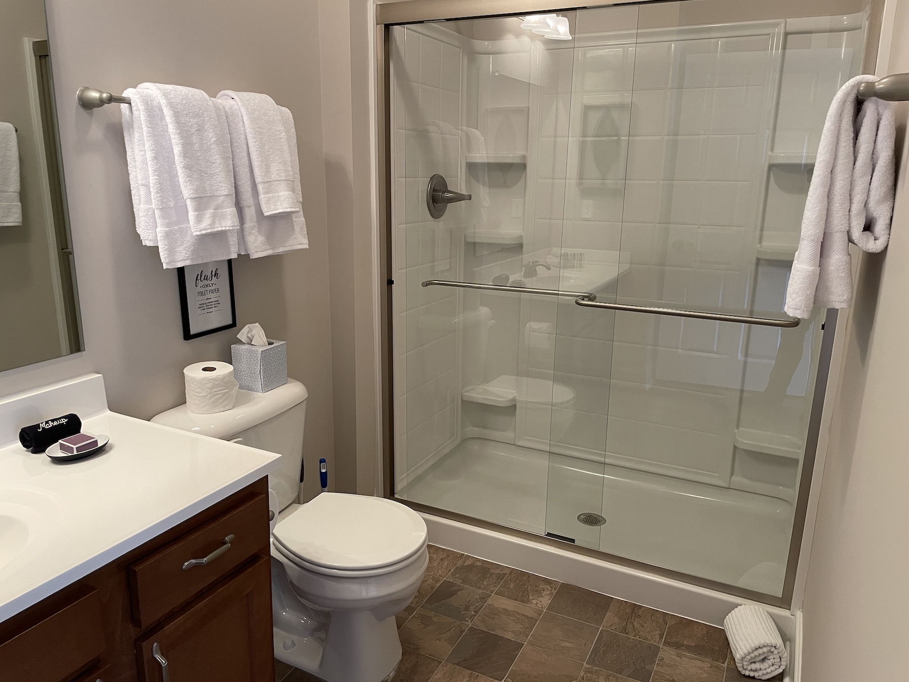 Walk-in shower in the guest bathroom of a furnished apartment in Westerville Ohio