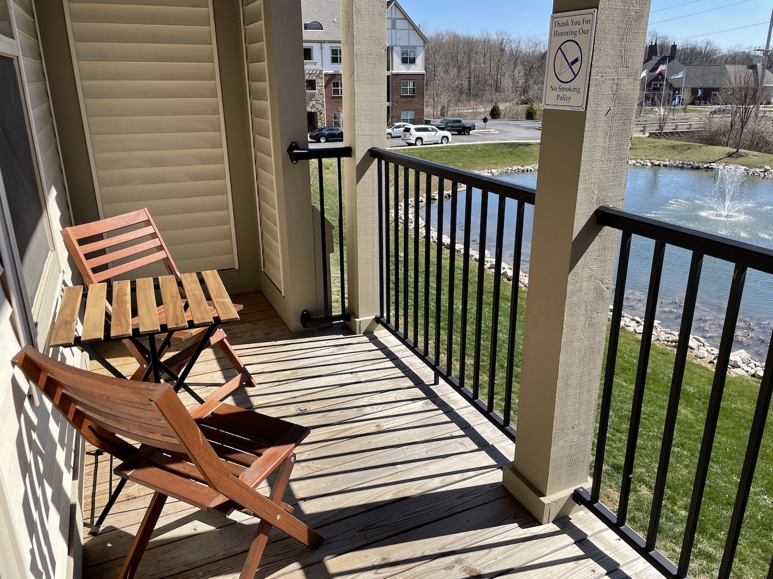 Outdoor balcony of a furnished apartment in Westerville Ohio overlooking a pond